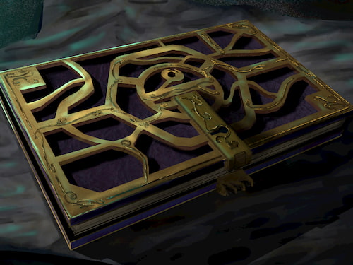 a gold gilded book lying on a old cloth